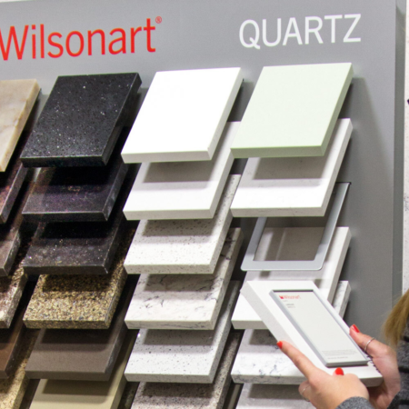 woman interacting with a wilsonart quartz display