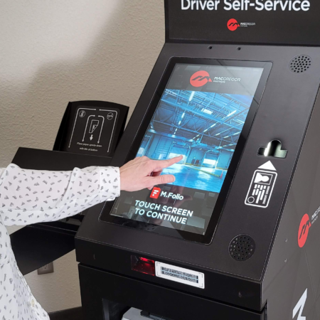 woman engaging with a driver self-service kiosk